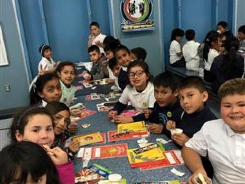 Group of kids eating lunch at school